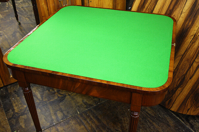 TABLE WITH DAMAGED BAIZE