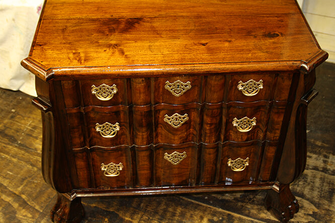 A SOUTH AFRICAN CHEST OF DRAWERS WHICH HAD NOT RECEIVED ANY TENDER LOVING CARE FOR A WHILE